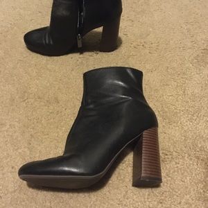 Black ankle boots with a stacked heel.
